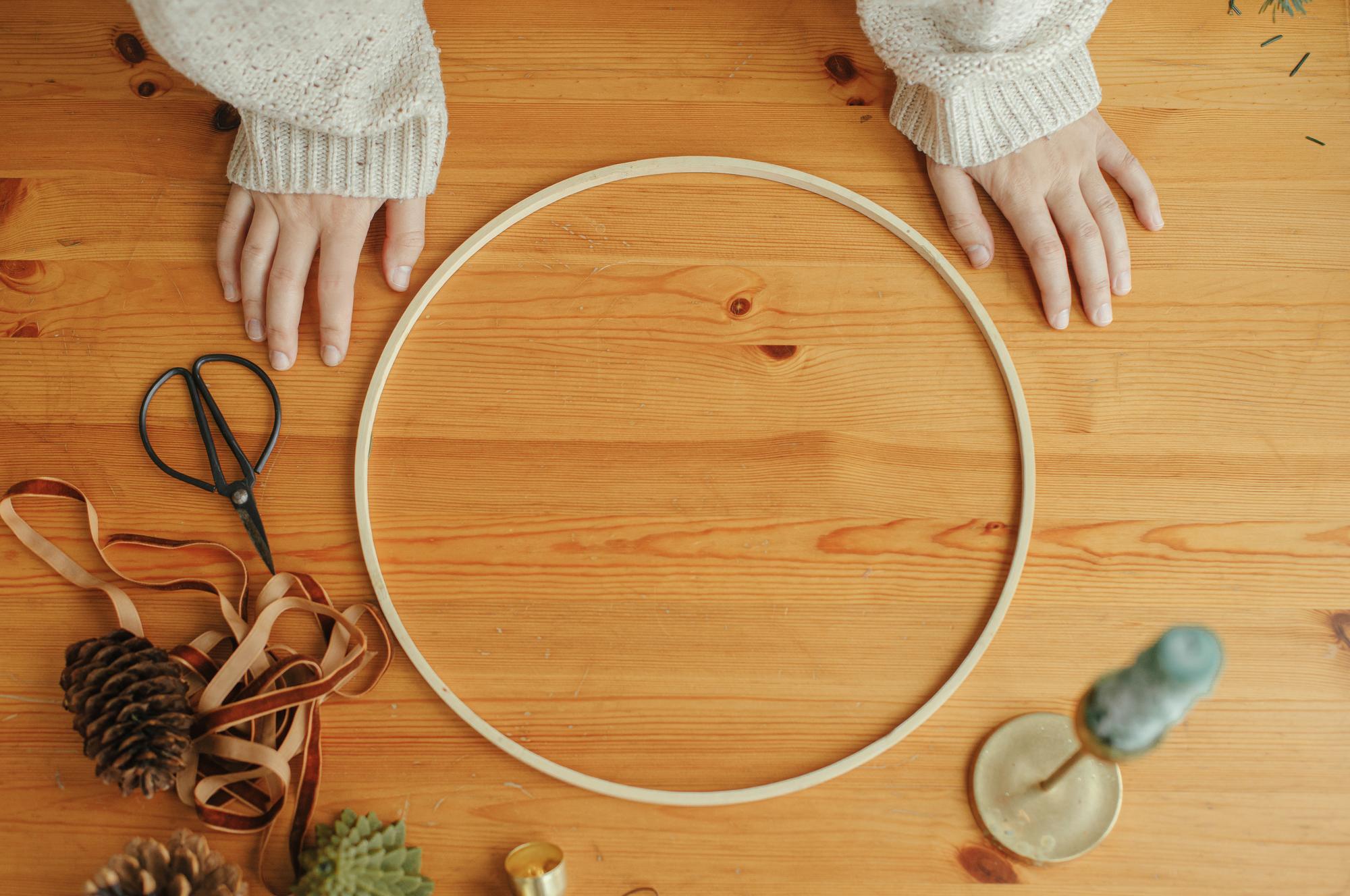 Atelier workspace with embroidery hoop and light